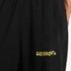 Pantaloni de trening baggy pentru bărbați, cu imprimeu spray dezordonat, de culoare neagră