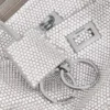 Pochetă de damă Rodeo cu curea de umăr, cu strasuri, în nuanța gri fum