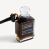 Talisman în formă de sticluță de parfum miniaturală, de culoare neagră