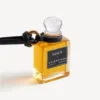Talisman în formă de sticluță de parfum miniaturală, de culoare neagră